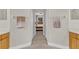 Bathroom with wood-look floors and cabinetry, leading to a bedroom beyond at 1913 Lazy Oaks Loop, St Cloud, FL 34771