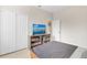 Bedroom with closet, television and media center, and a comfortable gray quilt at 1913 Lazy Oaks Loop, St Cloud, FL 34771