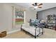 Bedroom with hardwood floors, a window, and a desk at 1913 Lazy Oaks Loop, St Cloud, FL 34771