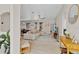 Spacious open-concept living area with wood floors, a comfortable sectional couch, and natural lighting at 1913 Lazy Oaks Loop, St Cloud, FL 34771