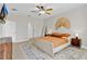 Spacious bedroom featuring a ceiling fan, neutral decor, and ample natural light, creating a relaxing space at 1913 Lazy Oaks Loop, St Cloud, FL 34771