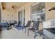 Covered patio with comfortable seating and views of the home's outdoor space at 1913 Lazy Oaks Loop, St Cloud, FL 34771
