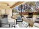 Enclosed patio with string lights, comfortable seating, and a grill at 1913 Lazy Oaks Loop, St Cloud, FL 34771