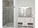 Bathroom featuring a walk-in shower and a dual sink vanity at 1947 Vienna Ave, Deltona, FL 32725