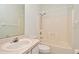 Bathroom with a shower and tub combination, a sink with countertop, and standard toilet at 1947 Vienna Ave, Deltona, FL 32725