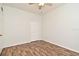 Bedroom featuring closet, ceiling fan, wood look flooring, and white walls and trim at 1947 Vienna Ave, Deltona, FL 32725