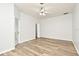 Well-lit bedroom with wood-look floors and an ensuite bathroom at 1947 Vienna Ave, Deltona, FL 32725