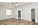 Bright bedroom with wood-style floors and ensuite access at 1947 Vienna Ave, Deltona, FL 32725