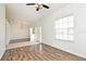 Large living room area featuring hardwood flooring, neutral walls, and lots of natural lighting at 1947 Vienna Ave, Deltona, FL 32725