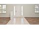 Living area with hardwood floors and lots of natural light that creates a bright interior at 1947 Vienna Ave, Deltona, FL 32725