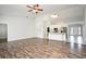 Bright living area with wood-style floors and an open floorplan at 1947 Vienna Ave, Deltona, FL 32725