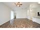 Spacious living room with sliding glass doors and wood-look floors at 1947 Vienna Ave, Deltona, FL 32725