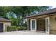 Backyard terrace showcasing a birdcage that opens up to the outside at 2009 Woody Dr, Windermere, FL 34786