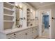 Bathroom featuring double sinks, white vanity and cabinetry, and a water closet with shower at 2009 Woody Dr, Windermere, FL 34786