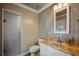 Bathroom with a sink with granite countertops, frameless shower, and neutral paint at 2009 Woody Dr, Windermere, FL 34786