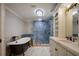 Bathroom features an oversized shower with a stand-alone tub and vanity at 2009 Woody Dr, Windermere, FL 34786