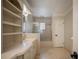 Bathroom includes a stand-up shower, a soaking tub, and double sink with vanity at 2009 Woody Dr, Windermere, FL 34786