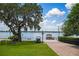 Community lake with a gazebo, golf cart and picnic area to relax and enjoy lake access at 2009 Woody Dr, Windermere, FL 34786
