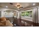 Bright living room featuring hardwood floors, large windows and traditional moldings at 2009 Woody Dr, Windermere, FL 34786