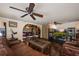 Relaxing living area with hardwood floors, stone arches and comfortable leather seating at 2009 Woody Dr, Windermere, FL 34786
