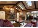 Inviting living room featuring vaulted ceilings and a rustic brick fireplace at 2009 Woody Dr, Windermere, FL 34786