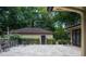 Spacious patio with tile flooring, iron railing, and lovely landscaped backyard views at 2009 Woody Dr, Windermere, FL 34786