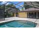 Inviting pool area with an outdoor kitchen and an adjacent patio for relaxation at 2009 Woody Dr, Windermere, FL 34786