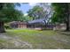 Beautiful screened pool area in a backyard surrounded by mature trees providing lots of shade at 2009 Woody Dr, Windermere, FL 34786