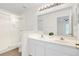 Bathroom featuring double sinks, shower, and white cabinets at 221 Sterling Springs Ln, Altamonte Springs, FL 32714