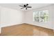 Spacious bedroom with hardwood floors, ceiling fan, and natural light at 221 Sterling Springs Ln, Altamonte Springs, FL 32714