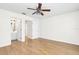 Light-filled bedroom with hardwood flooring and access to the bathroom at 221 Sterling Springs Ln, Altamonte Springs, FL 32714