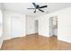 Bright bedroom with hardwood floors and direct access to the bathroom at 221 Sterling Springs Ln, Altamonte Springs, FL 32714