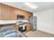 Well-equipped kitchen featuring stainless steel appliances and wood cabinetry at 221 Sterling Springs Ln, Altamonte Springs, FL 32714