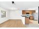 Bright, open layout seamlessly connects the living area to the kitchen with stainless steel appliances at 221 Sterling Springs Ln, Altamonte Springs, FL 32714