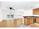 Open concept living area with hardwood floors, fan, and sliding glass doors leading to outdoor space at 221 Sterling Springs Ln, Altamonte Springs, FL 32714