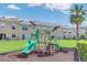 Community playground with slides and play equipment adjacent to townhomes at 221 Sterling Springs Ln, Altamonte Springs, FL 32714