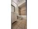 Full bathroom with a single sink vanity, tiled floors and shower walls, and good lighting at 2235 Silver Pines Pl # 401, Orlando, FL 32808