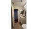 Cozy bathroom with tiled floors, a single sink vanity, and an open doorway to another room at 2235 Silver Pines Pl # 401, Orlando, FL 32808