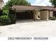 Residential property with a carport providing covered parking spaces and landscaped greenery at 2235 Silver Pines Pl # 401, Orlando, FL 32808