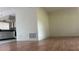 Spacious living area featuring laminate wood floors connecting to the kitchen area at 2235 Silver Pines Pl # 401, Orlando, FL 32808