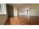 Open concept living area showcases laminate wood floors and an airy atmosphere at 2235 Silver Pines Pl # 401, Orlando, FL 32808