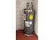 Gray Rheem Performance water heater with an energy guide sticker in the utility room at 2235 Silver Pines Pl # 401, Orlando, FL 32808