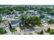 An aerial view showcases a neighborhood with well-maintained homes, lush trees, and the street view at 232 E Grant St, Orlando, FL 32806