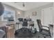 Functional bedroom featuring wood flooring and a ceiling fan at 232 E Grant St, Orlando, FL 32806
