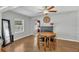 Inviting dining area featuring hardwood floors and a decorative fireplace at 232 E Grant St, Orlando, FL 32806