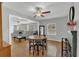 Open-concept dining and living area featuring hardwood floors and a cozy atmosphere at 232 E Grant St, Orlando, FL 32806