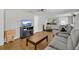 Spacious living room featuring hardwood floors, and a large window with natural light at 232 E Grant St, Orlando, FL 32806