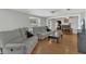 Inviting living room with hardwood floors and modern furnishings, open to dining area at 232 E Grant St, Orlando, FL 32806