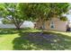 Expansive backyard with mature trees, offering a private and shaded outdoor space at 2407 Accord Ter, Kissimmee, FL 34758