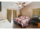Cozy bedroom with vaulted ceilings, a ceiling fan, and dual closets for ample storage at 2407 Accord Ter, Kissimmee, FL 34758